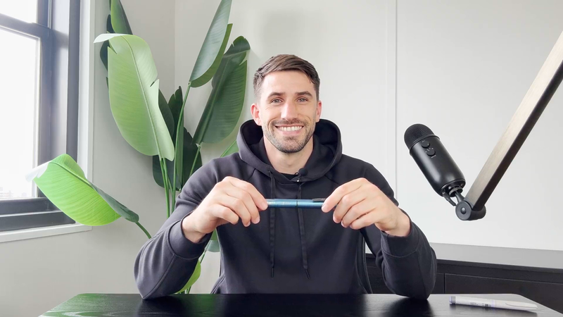 stable host holding a continuous glucose monitor applicator.