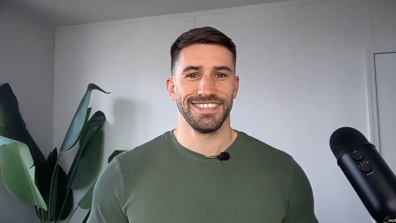 stable host Eoin Costello smiling to camera during a guided episode.